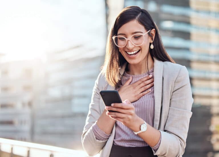 Smiling woman looking at phone