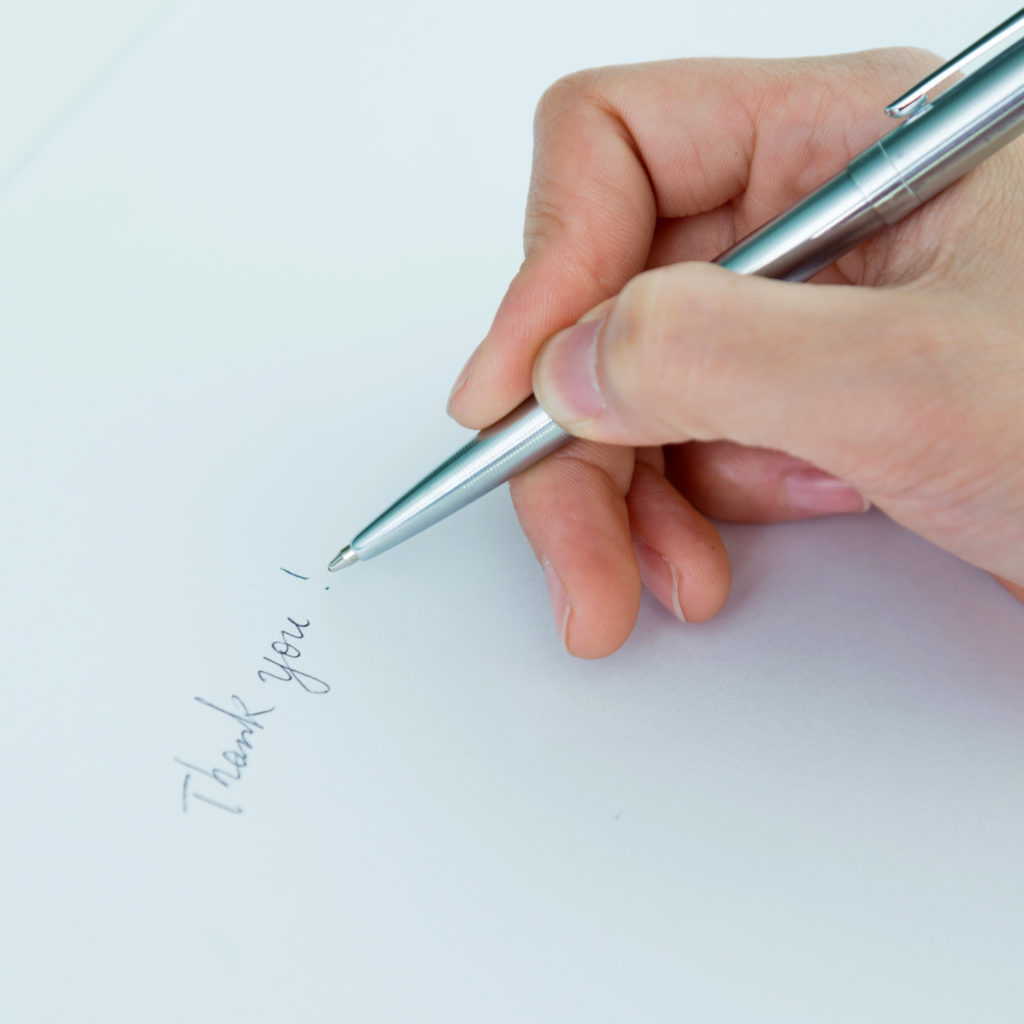 Alt text: Handwritten notes are a personal way to recognize employees for their hard work.