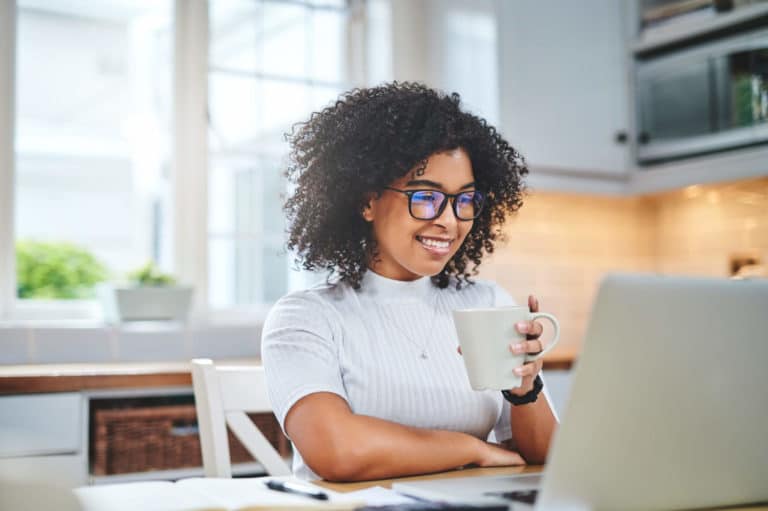 woman smiling at computer